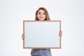 Smiling woman showing blank board Royalty Free Stock Photo