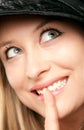 Smiling woman showing shush