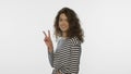 Smiling woman showing v sign on white background. Positive girl show v gesture Royalty Free Stock Photo