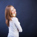 Smiling woman sidewise with crossed arms