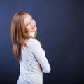 Smiling woman sidewise with crossed arms Royalty Free Stock Photo