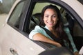 Smiling woman sitting at the wheel of her new car Royalty Free Stock Photo