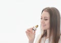 Smiling woman sniffs eucaliptus oil, immunity boost and respiratory health. althernative medicine concept. copy space for text Royalty Free Stock Photo