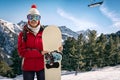 Smiling woman in snowy mountains, extreme sport and winter holiday Royalty Free Stock Photo