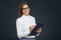 Smiling woman social employee writes on clipboard.