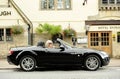 Smiling woman in sports car