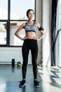 Smiling woman standing with hands on hips Royalty Free Stock Photo