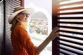 woman standing in rooftop penthouse terrace shutter doors and enjoy the view over the city Royalty Free Stock Photo