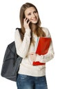 Smiling woman student talking on cell phone Royalty Free Stock Photo