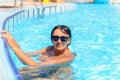 Smiling woman in a swimming pool Royalty Free Stock Photo