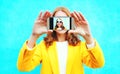 smiling woman takes a picture self portrait on smartphone Royalty Free Stock Photo