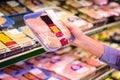 Smiling woman taking meal in the aisle