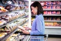 Smiling woman taking meal in the aisle