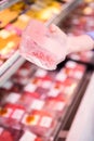 Smiling woman taking meal in the aisle