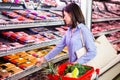 Smiling woman taking meal in the aisle