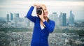 Smiling woman taking picture with digital camera Royalty Free Stock Photo