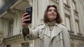 Smiling Woman Taking Selfie On Urban Street. Girl Pouting Lips For Phone Camera.