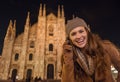 Smiling woman talking cell phone near Duomo in evening, Milan Royalty Free Stock Photo