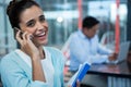 Smiling woman talking on mobile phone Royalty Free Stock Photo