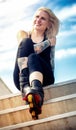 Smiling woman with tattoos and roller blades Royalty Free Stock Photo