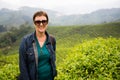 Smiling woman is on tea plantations of Cameron Highlands, Malays Royalty Free Stock Photo