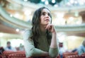 Smiling woman theatre goer looking at play Royalty Free Stock Photo