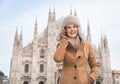 Smiling woman tourist talking cell phone near Duomo, Milan Royalty Free Stock Photo