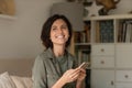 Smiling woman use modern cellphone browsing internet Royalty Free Stock Photo