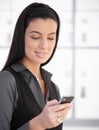 Smiling woman using cellphone Royalty Free Stock Photo