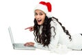 Smiling woman using laptop laying on floor Royalty Free Stock Photo