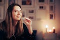 Smiling Woman Using an Orthodontic Transparent Silicone Teeth aligner at Night Royalty Free Stock Photo