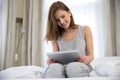 Smiling woman using tablet computer Royalty Free Stock Photo