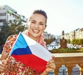Smiling woman on Vaclavske namesti in Prague showing flag Royalty Free Stock Photo