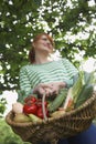 Smiling Woman With Vegetable Basket Royalty Free Stock Photo