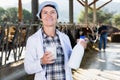 Woman veterinarian with cow milk at cowshed on dairy farm Royalty Free Stock Photo