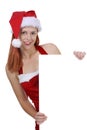 Smiling woman wearing Christmas Santa hat Royalty Free Stock Photo