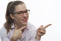 Smiling woman in pink blouse pointing to the left Royalty Free Stock Photo