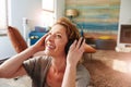 Smiling woman wearing headphones and listening to music Royalty Free Stock Photo