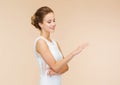 Smiling woman in white dress with diamond ring Royalty Free Stock Photo