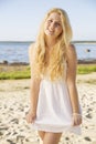 Smiling woman in white dress with hairs