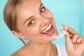 Smiling Woman With White Teeth Holding Teeth Whitening Tray Royalty Free Stock Photo