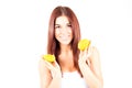 Smiling woman with white teeth holding two halfs of orange. Royalty Free Stock Photo