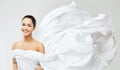 Smiling Woman in White Waving Dress, Silk Cloth Fluttering on Wind, Fashion Model Beauty Portrait