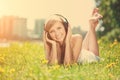 Smiling woman Woman listening to music on headphones outdoors Royalty Free Stock Photo