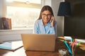 Smiling woman working at laptop