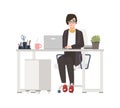 Smiling woman working at office. Female clerk dressed in smart clothes sitting in chair at desk with computer. Funny Royalty Free Stock Photo