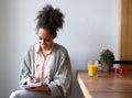 Smiling woman writing on note pad at home Royalty Free Stock Photo