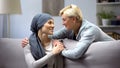 Smiling woman with cancer hugging mother, hope and togetherness, remission