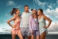 Smiling woman and man fitness team. A happy group of runners rest after running along the sea coast early in the morning Royalty Free Stock Photo