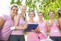 Smiling women organising event for breast cancer awareness Royalty Free Stock Photo